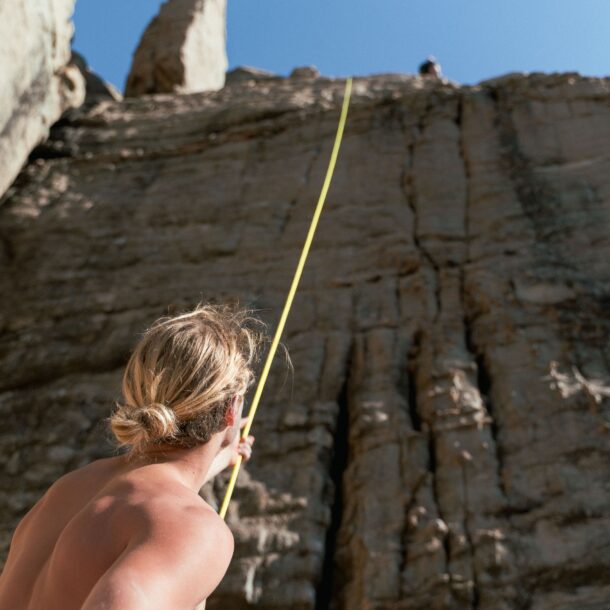 Photo by Liam Moore: https://www.pexels.com/photo/man-holding-climbing-rope-at-the-foot-of-a-rock-face-10867135/