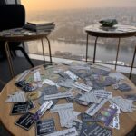 Stickers on a table with skyline view behind