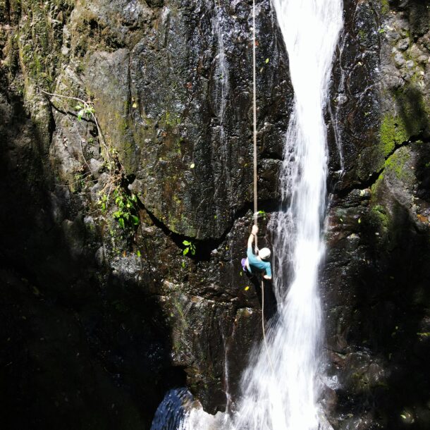 Abseiling down a waterfall