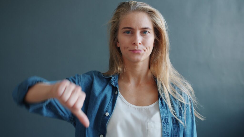 Woman giving thumbs down