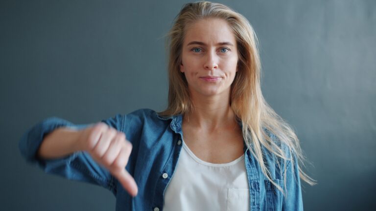 Woman giving thumbs down
